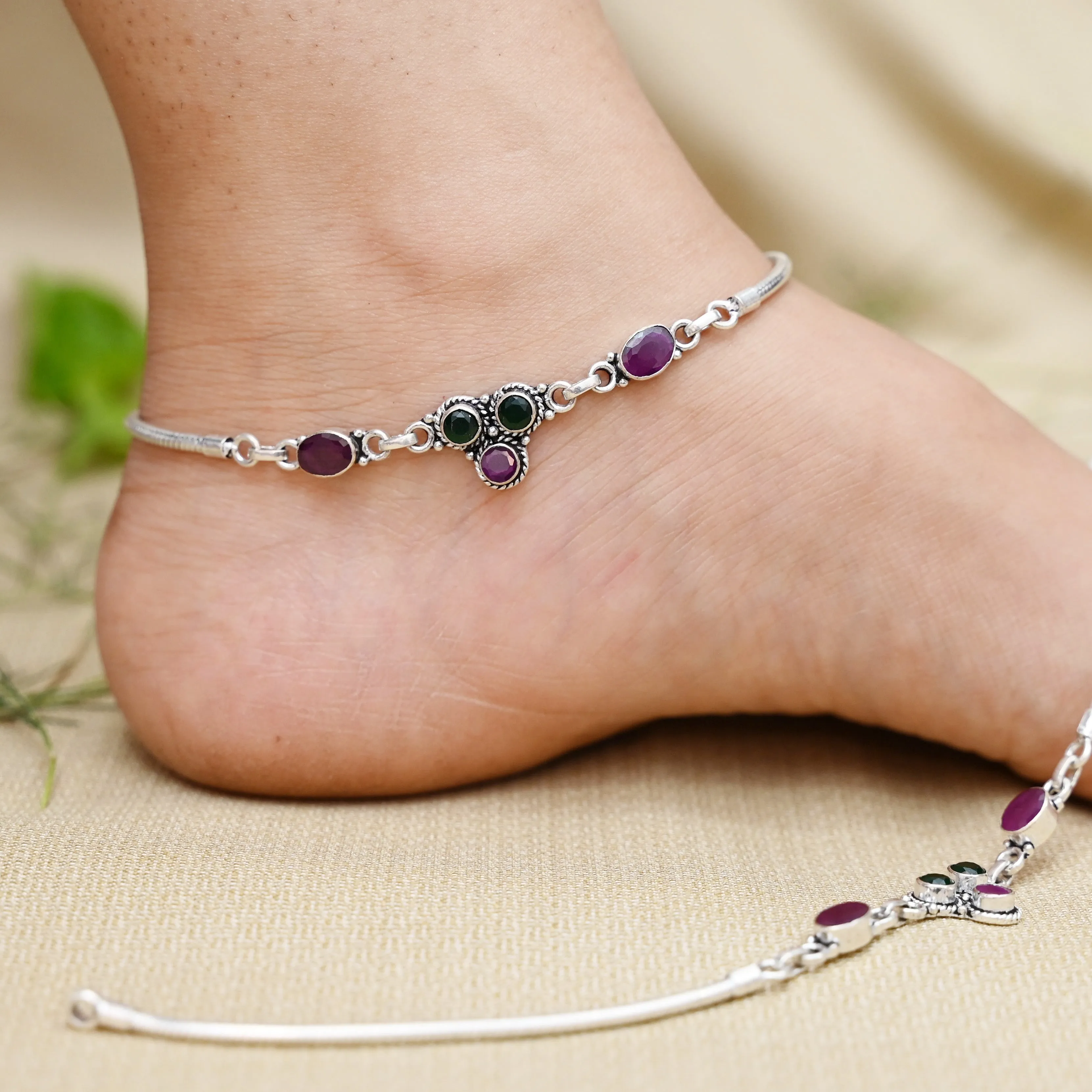 Handcrafted Silver Payal Adorned with Vibrant Purple & Green Gemstones